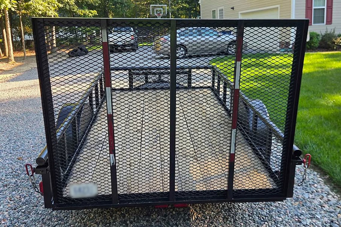 WhereWithHaul open utility trailer with mesh ramp gate