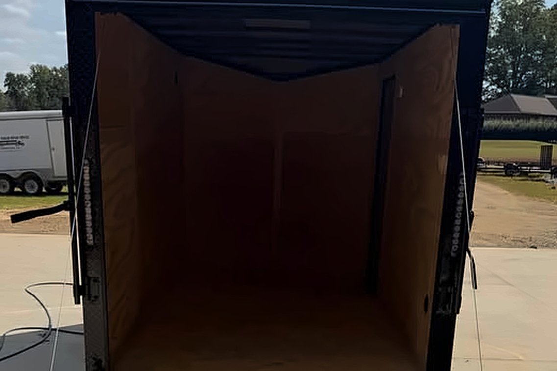 WhereWithHaul enclosed trailer with ramp door down, empty and ready to load